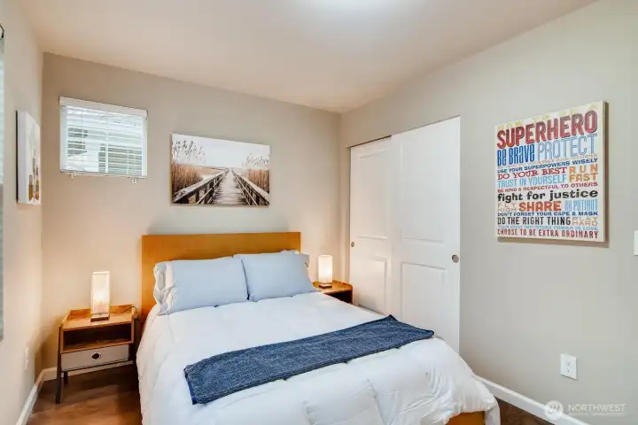 Third bedroom on the first floor with closet space and versatile use options.