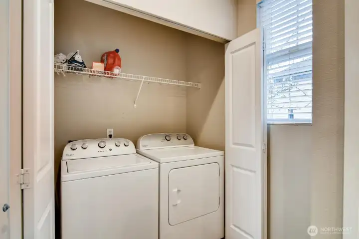 Laundry nook on the second floor for convenience and easy access.