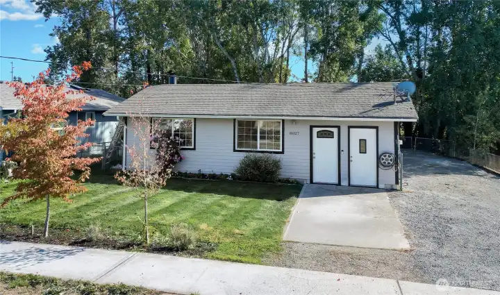 View from street. home has nice size yard. With RV parking, additional vehicles and toys.