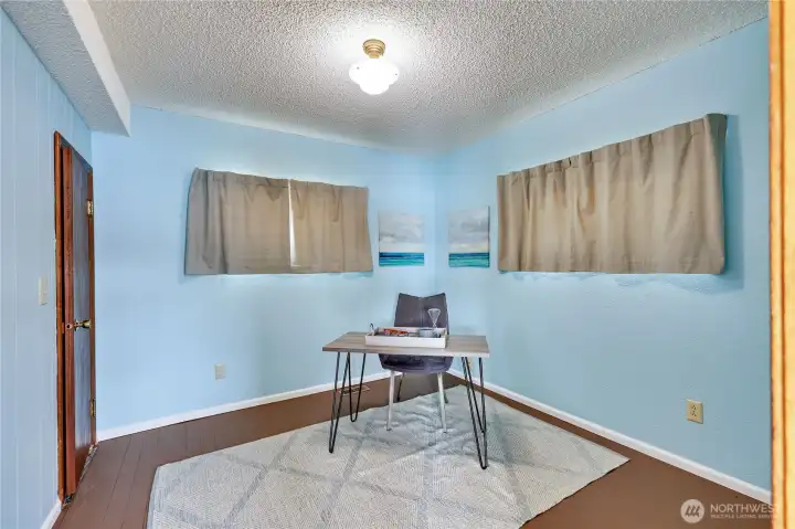 Bedroom to the right at entry with closet to the left.