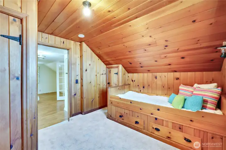 2nd bedroom on upper level with built in twin bed and closet to the left.