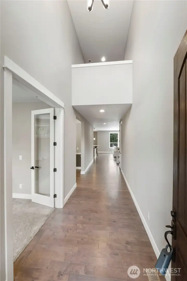 Enter to gleaming hardwoods and soaring ceilings
