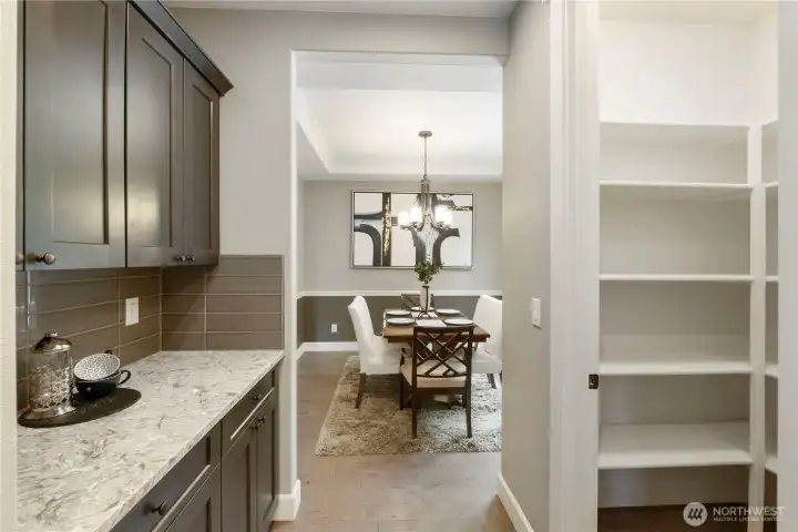 Butlery offers great serving space leading from the kitchen to the formal dining area.