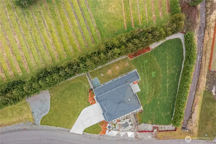 Overhead view of the portion of the property featuring the home, front and back yards.