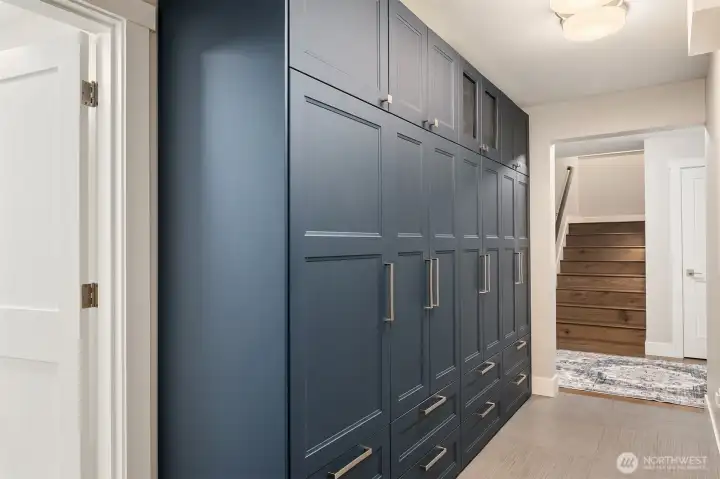 Mudroom off the garage with custom cabinets.