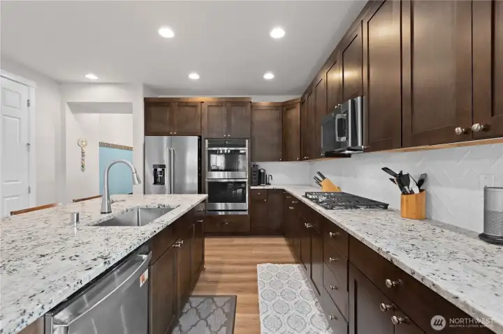 Enjoy touch facet, double ovens, and gas stove top!  All appliances stay!