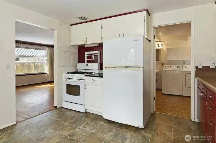 Entry to the utility room with a half bath.