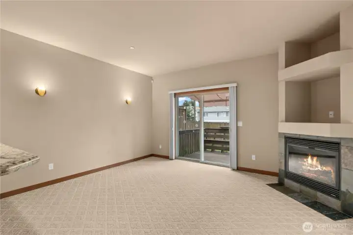 The glass sliding door with screen opens to the low-maintenance Trex deck. Hunter Douglas window treatments on both the slider and the windows offer a few options; open for full light, closed sheers for privacy and to diffuse direct sun, and closed for full darkness.