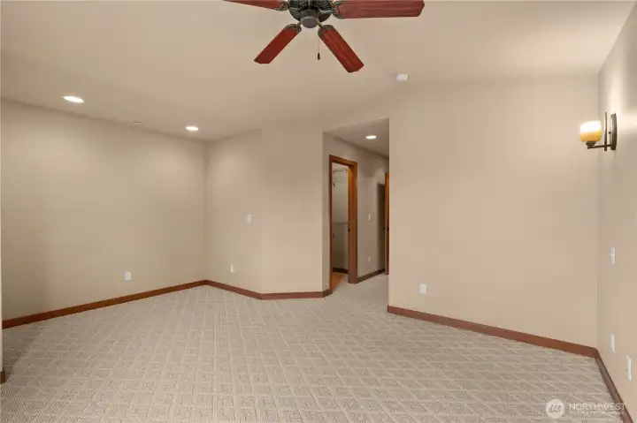 Another view of the primary bedroom; the walk in closet is to the left, the full bath to the right.