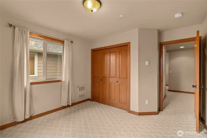 Another view of the second bedroom, with the third bedroom just around the corner.