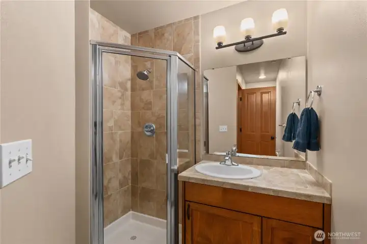 Upstairs 3/4 bath services the additional two bedrooms.