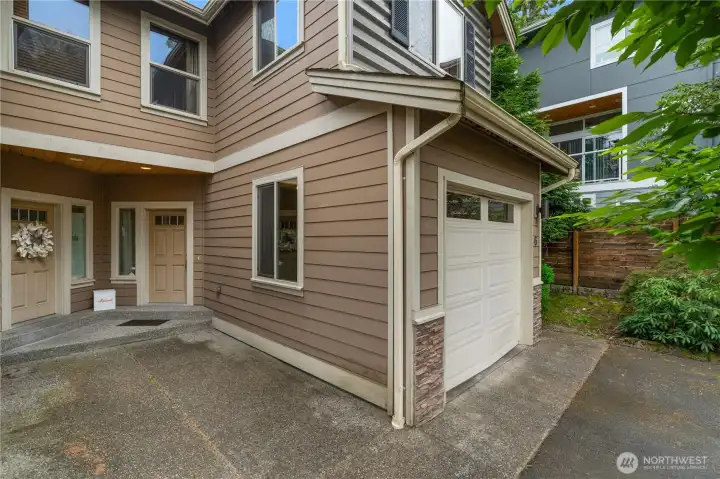 The aggregate path leads you to the front door and patio with cedar accents above.