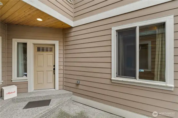 The view of your new front door, with the window to the right letting light into the garage.