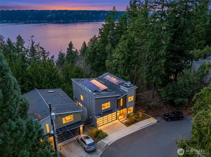Featuring filtered views of Lake Sammamish and a lush tree canopy backdrop