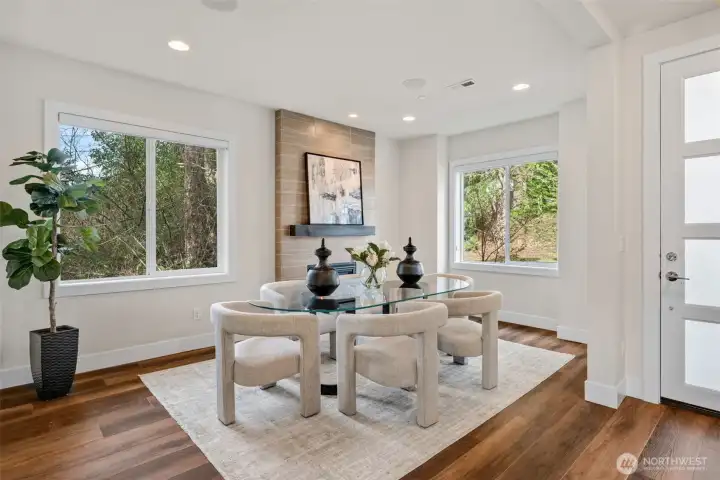 A versatile front flex room with its own gas fireplace offers endless possibilities