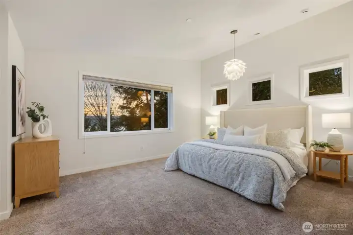 Upstairs, the primary suite is a true retreat