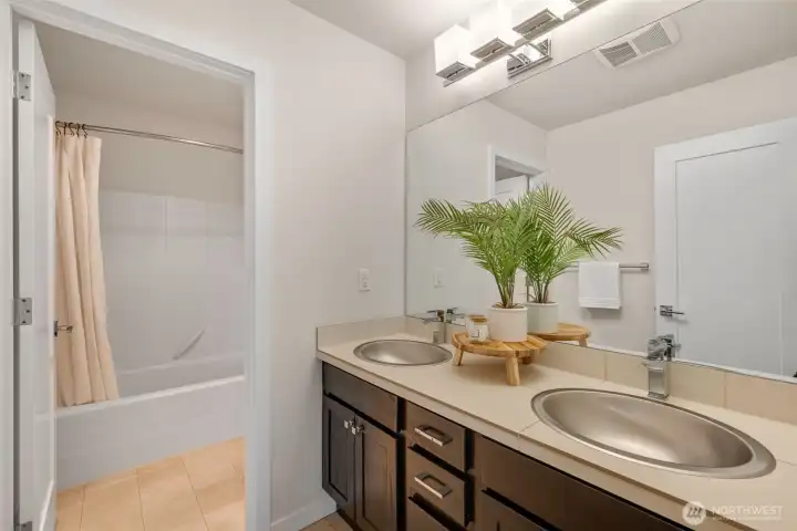 Full bath with dual sinks upstairs