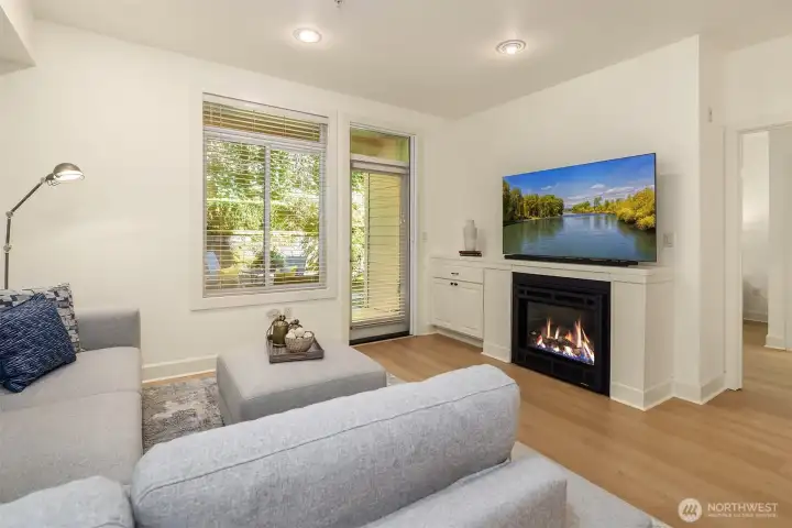 Electric fireplace provides ambiance for chilly nights.  Retractable screen door to patio