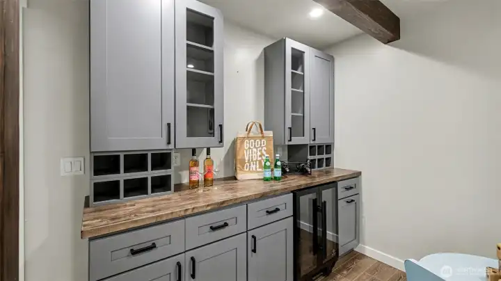 Dedicated dry bar offers a convenient setup for hosting and everyday enjoyment.