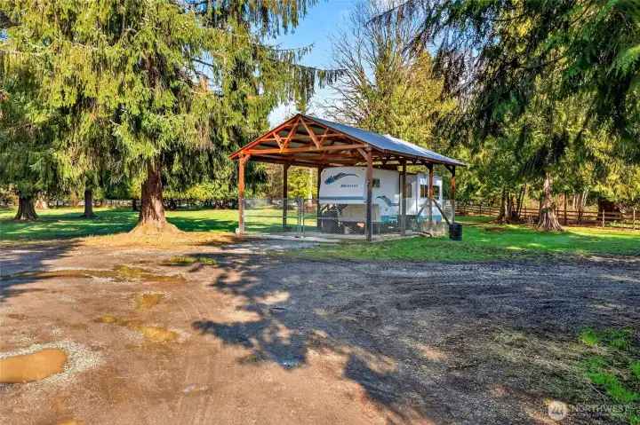 Two Rv pads with water, power and septic  One pad is covered with poured concrete pad  The other pad is gravel with no cover