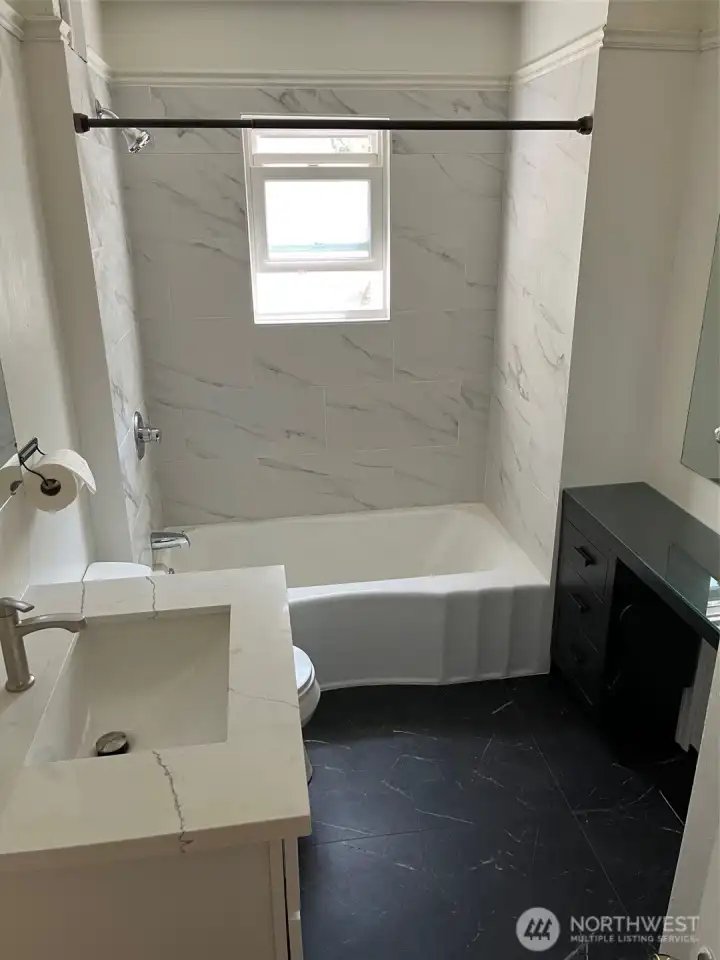 Upper Unit Bathroom  on main floor (Taken before the tenants moved in)
