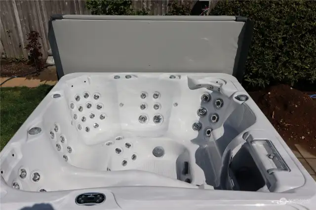 Spa: Hot tub installed in summer of 2020.  Brand: Tropical Seas Spas.  Variety: Waikiki.  New (2024) weather resistant cover has an easy lift bar.  3 powerful pumps get rid of aches and pains; double filters to help keep the water clean.  Waterfall effect sounds wonderful.  There are many options within the color-changing lights.  This hot tub is great for stargazing & relaxing.  It has been meticulously maintained and comes with the seller's instructions on how to continue its cleanliness & longevity.