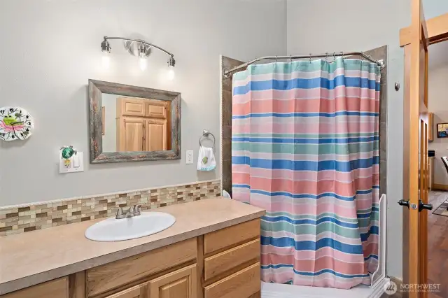 Upper level full bathroom. There is a beautiful jetted tub and large window to enjoy.