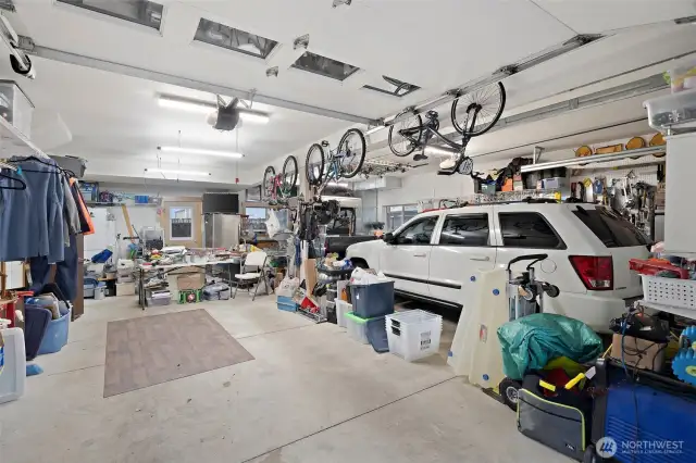 Oversized garage. 2 car plus tons of space. Wall could easily be placed where the beam is to create an apartment space in the back of the garage, leaving room for 2 cars still.