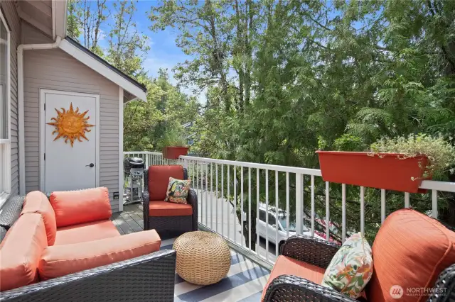 Sunny deck off the great room with storage