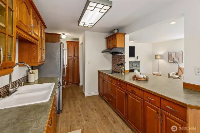 Kitchen opens to living room and dining