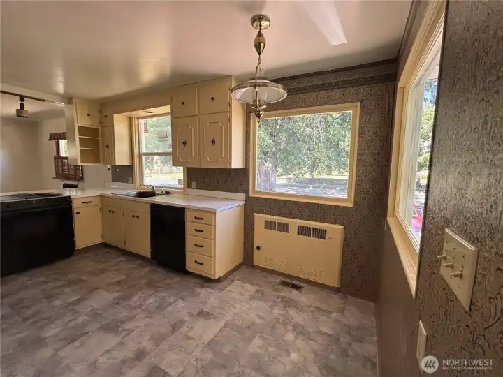 The kitchen has a seperate outside entry and has lots of windows to let the light shine in.