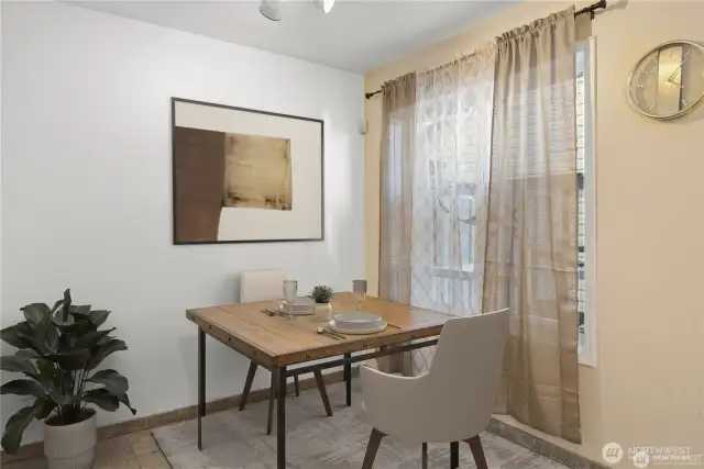 Virtually staged dining area to show to space and potential of a dining area located off the kitchen.