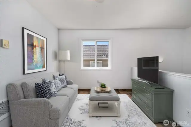 Virtually staged as a tv area, this space would also make a office as well!
