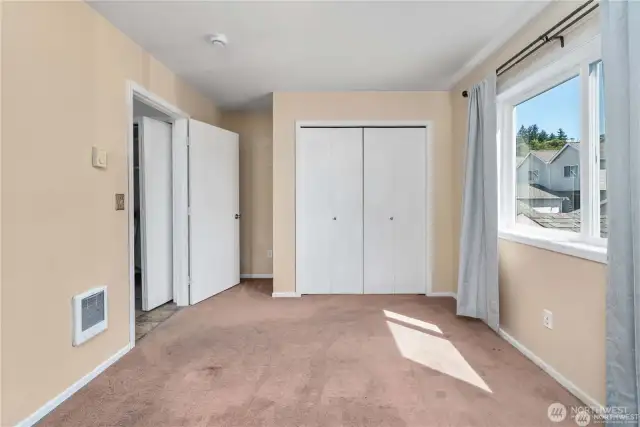 Spacious bedroom no. 2 located on the upper level.