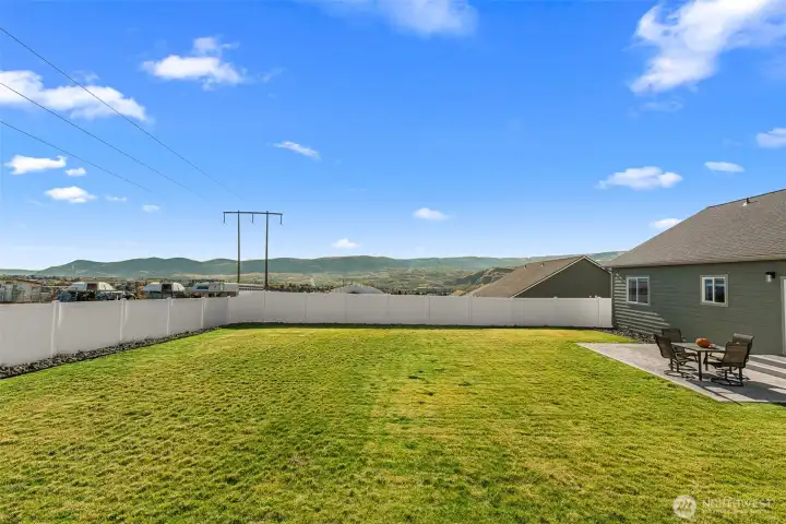 Back yard views to the South showing plenty of room for play or even that pool you were thinking about.