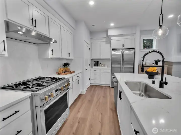 Generous kitchen cabinets highlighted by a coffee bar space.  Photo is of model. Elements in home can vary