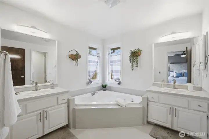 Primary Bathroom - enjoy a nice soaking tub and dual vanities!