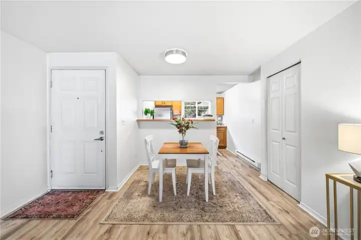 Generous dining space with entry closet leading into the kitchen.