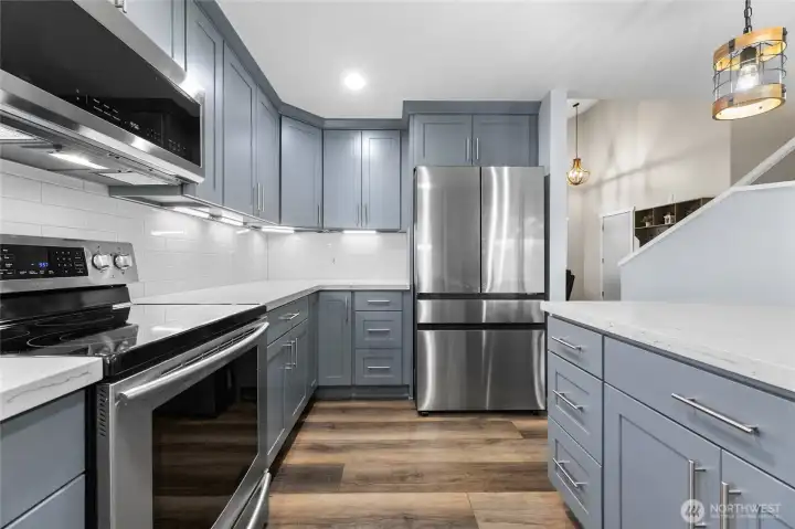 Refrigerator, Under Cabinet Lighting, and Quartz Countertops