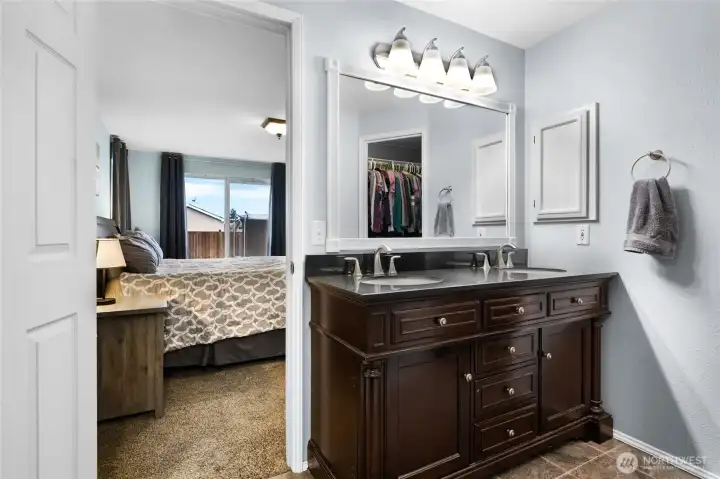 Main Level Primary Bathroom looking into Primary Bedroom