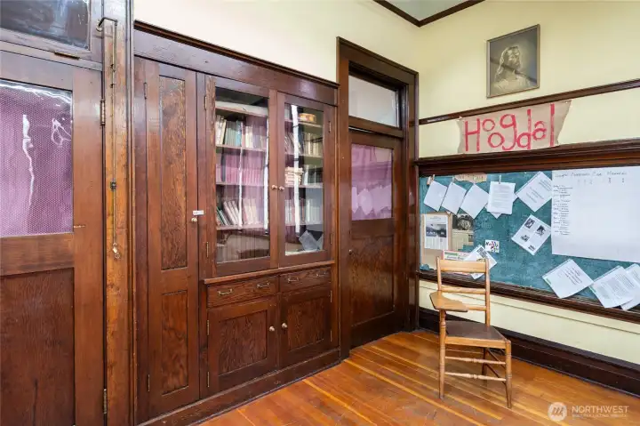 Built in storage and book cases. One of the drawers is autographed by original builder!