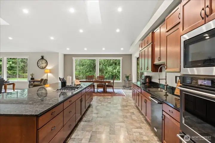 Another view of kitchen. The walkthrough is large enough for a wheelchair to pass through w/ the dishwasher door open.