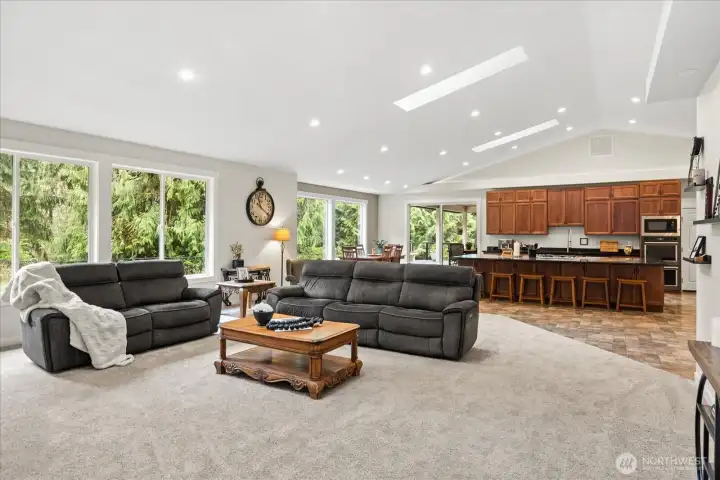 Expansive showcase windows bathe the home in natural light.