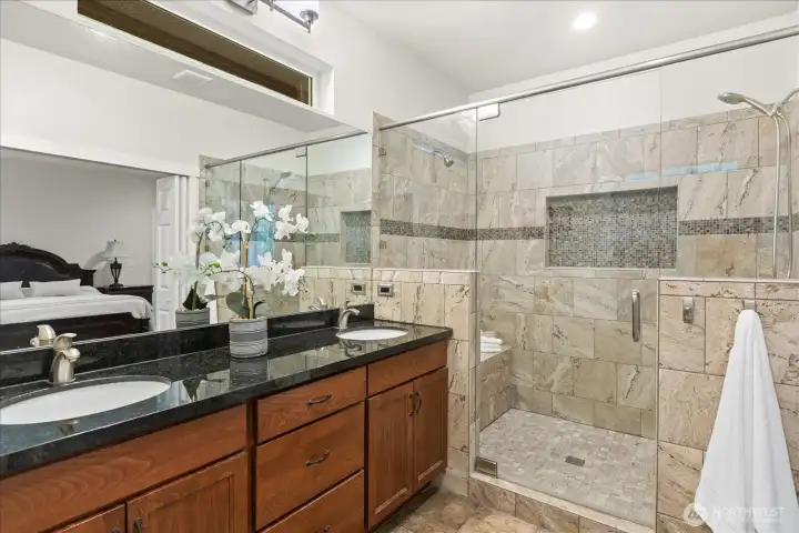 Primary bath showcasing dual shower heads.