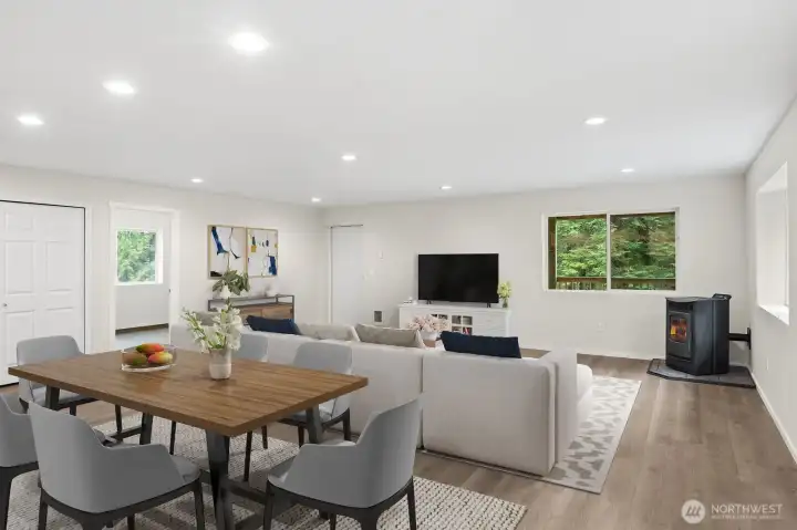 VIRTUALLY STAGED great room in DADU, new construction, this view shows pellet stove