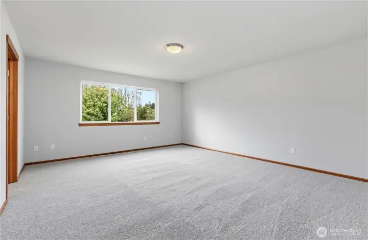 Primary bedroom on level 2. Brand new wall-to-wall carpet.