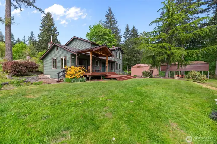 Welcome to peaceful acreage. New roof and newly painted exterior home with a huge shop, a greenhouse, outbuildings, wood storage, and an open run in haybay shed.