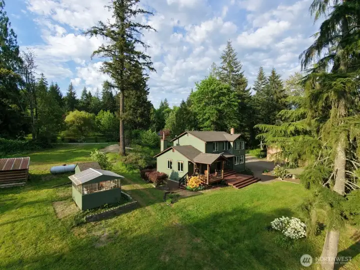 Bucolic scenery with all day sun tracking across your South facing front door and main entertaining partially covered deck. Outbuildings abound for your many hobbies and interests.