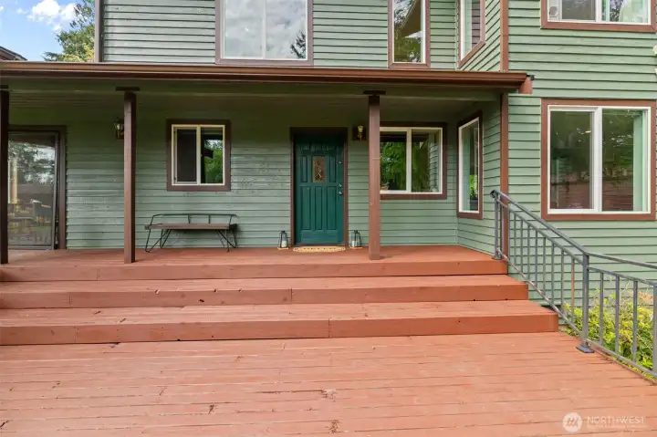 Covered front porch and wood deck welcomes you home!