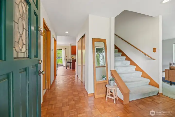 Original Parquet floors welcome you off the extra large entertainment sized front wood deck.